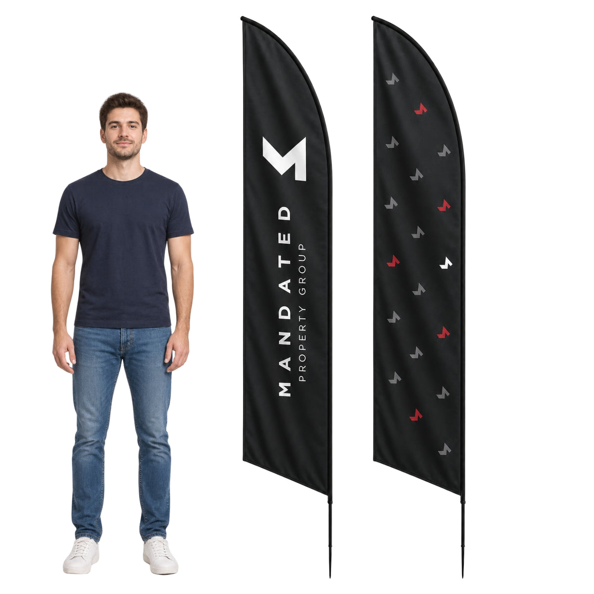 A man wearing a navy blue t-shirt and jeans stands next to two black feather-style flags on a white background. One flag displays a large white 'M' logo with the text 'MANDATED PROPERTY GROUP' vertically printed in white.