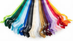 A fan arrangement of satin ribbon streamers in multiple colors, including green, blue, black, white, beige, brown, purple, pink, red, and orange, on a white background.